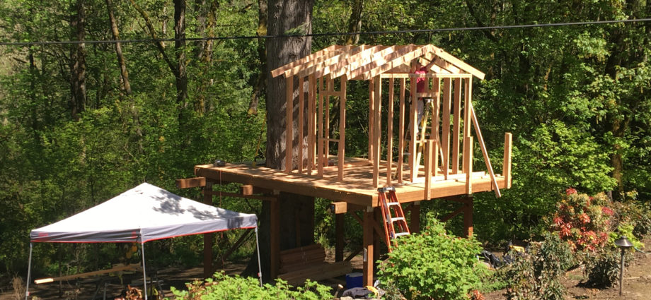 Deck with framed playhouse