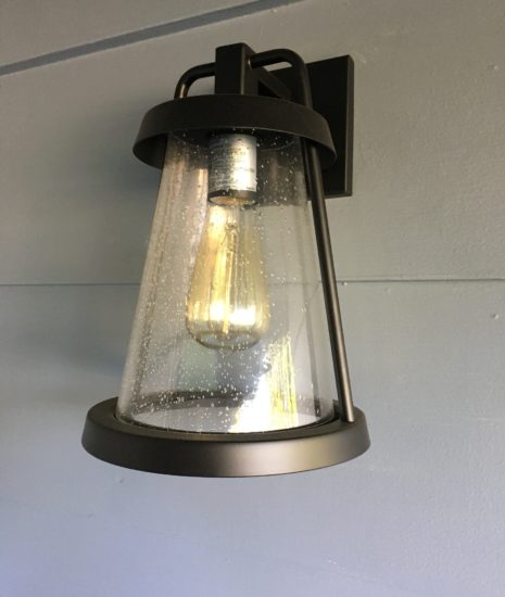 Black lantern with seeded glass and Edison bulb