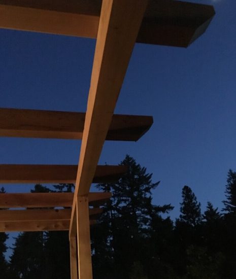 Pergola above deck against the night sky