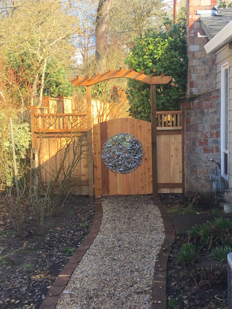 Custom gate with artwork and arbor