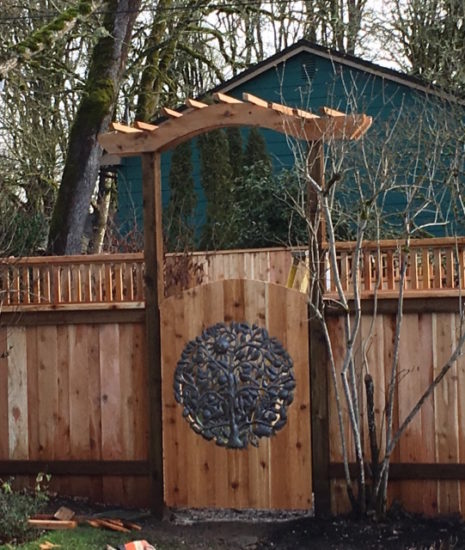 Custom gate with arbor and artwork